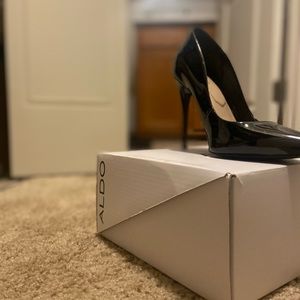 Black patent leather heels.